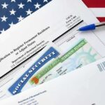 Michigan Workers at Center Push for Stricter Immigration immigration forms with green card and social security card on US flag background