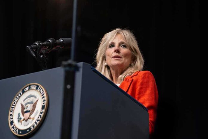 shutterstock_1670193076 Woman speaking at a podium with a U.S. government seal