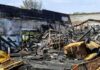 Burned building interior with collapsed charred debris