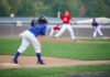 Offshore Books Put Odds on Little League Young baseball player in blue uniform preparing to run on the field