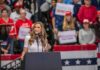 Celebrity Broadcaster Takes Minnesota GOP Nomination Walter Jones speaks at a rally podium with a crowd and flags in the background