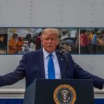 MAJOR WIN — Trump Saves U.S. From Federal Crisis Donald Trump speaks at a podium with arms outstretched