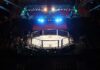 Weigh-In Drama Teases Explosive Main Event MMA octagon cage under arena lights