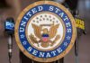 United States Senate seal at a podium