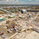 Aerial view of coastal town with widespread storm damage