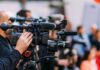 Courtside Turns Into a Knicks Fan Video cameras on tripods at a media event