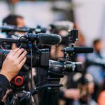Courtside Turns Into a Knicks Fan Video cameras on tripods at a media event