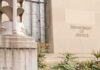 A Tax Settlement Is Holding Up Trump’s AG Pick Department of Justice building facade with stone sign and window