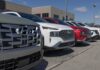 U.S. Fuel-Economy Rules Face Major Shift Row of SUVs parked at a dealership lot