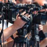 Navy’s Biggest Embarrassment Becomes China’s Worst Nightmare television cameras on tripods at a media event