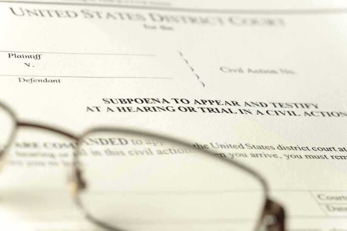 Subpoena document with reading glasses