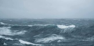 Rough ocean waves under a cloudy sky