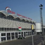 Middle East Tensions Show No Signs of Easing airport terminal exterior with modern facade and roadway