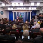 Intel Reset Signals Begin to Emerge Press secretary at podium addressing reporters in briefing room