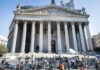 300,000 Voter Records Under Federal Review Reporters and photographers gathered outside a neoclassical courthouse