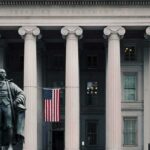 Medicare Part B Enrollees Set to Receive $90 Statue in front of a neoclassical government building with columns and a U.S. flag