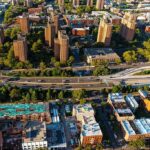 Trump Blames Democrats for New York’s Taxpayer Exodus Aerial view of city high-rise apartments and highway