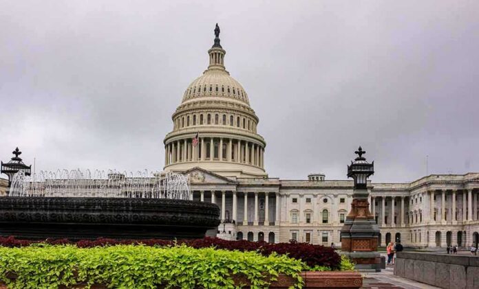 United States Capitol building with dome and fountain in foreground