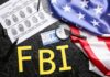 FBI Director’s Reported Russia Trip Sparks Confusion FBI letters with fingerprint sheet, badge, magnifying glass, and US flag