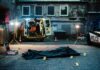 Surveillance Video and Phone Data Lead to Shooting Charges crime scene with body bag in alley