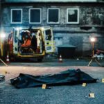 Surveillance Video and Phone Data Lead to Shooting Charges crime scene with body bag in alley