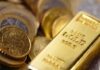 Gold bar and coins close-up
