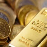 Central Banks Boost Gold Reserves Amid Uncertainty Gold bar and coins close-up